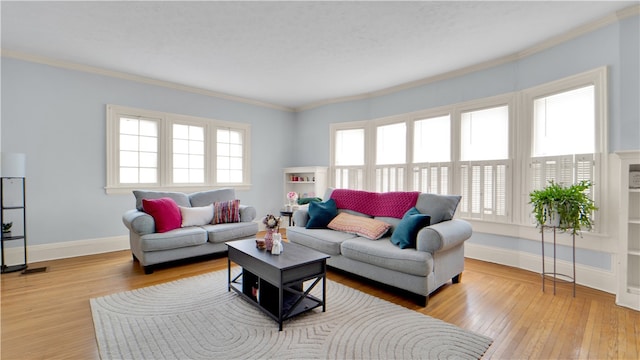 living room featuring light hardwood / wood-style floors and crown molding