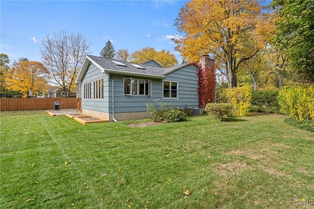 view of property exterior featuring a lawn