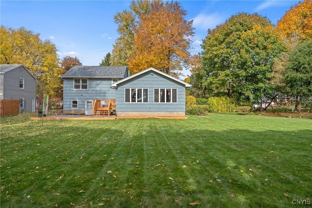 rear view of house with a yard