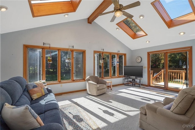 living room with beam ceiling, a skylight, high vaulted ceiling, ceiling fan, and light colored carpet