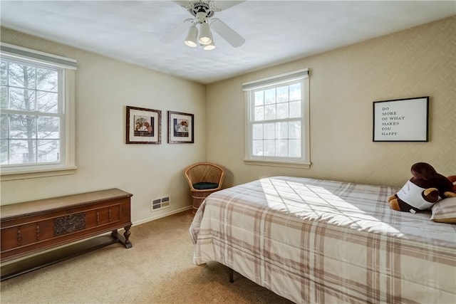 carpeted bedroom with ceiling fan