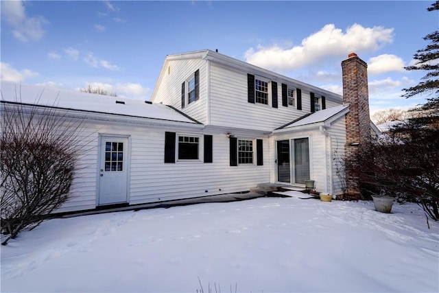 view of snow covered house