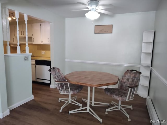 dining space featuring ceiling fan, baseboard heating, and dark wood-type flooring