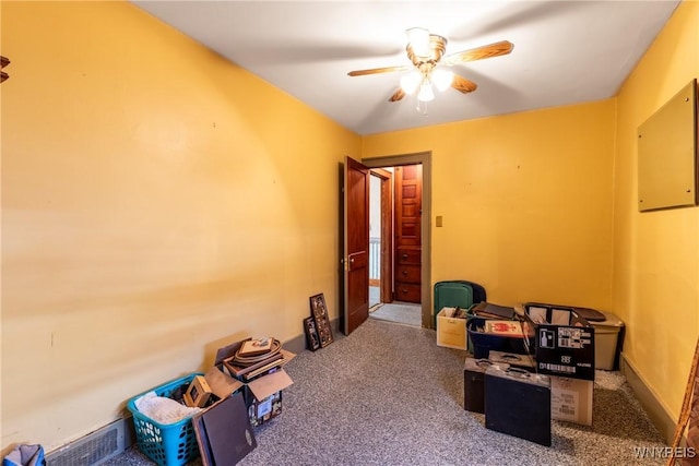 miscellaneous room featuring carpet floors and ceiling fan