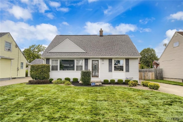 bungalow-style home with a front lawn