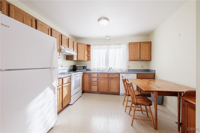 kitchen featuring white appliances and sink