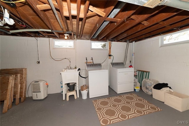 washroom featuring plenty of natural light and separate washer and dryer