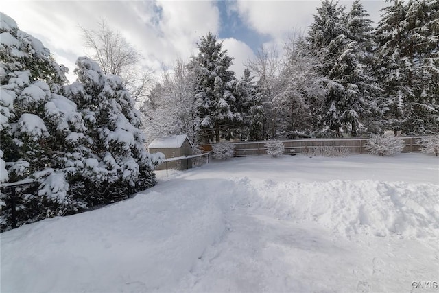 view of yard layered in snow