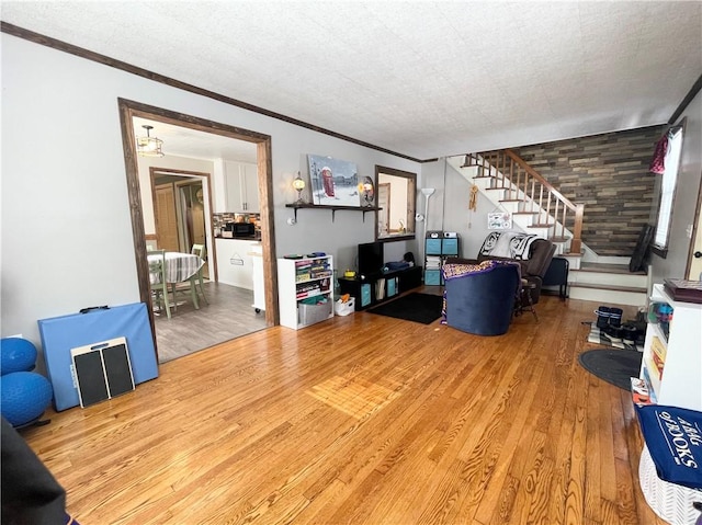 living room featuring ornamental molding and hardwood / wood-style floors