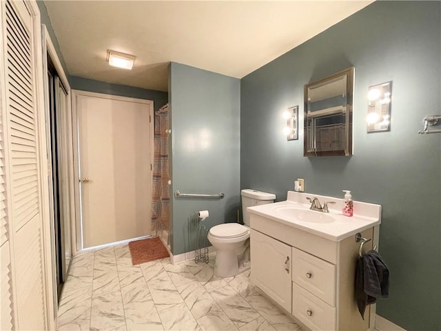 bathroom featuring toilet and vanity