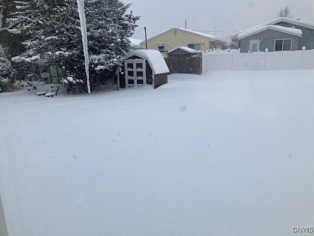 view of yard covered in snow