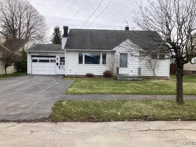 1612 Copperfield St, Utica, NY 13501 - view of front of house with an attached garage, a chimney, aphalt driveway, and a front yard