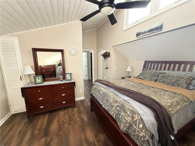 bedroom featuring lofted ceiling, ornamental molding, wooden ceiling, ceiling fan, and dark wood-type flooring