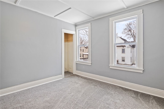 empty room with carpet flooring and baseboards