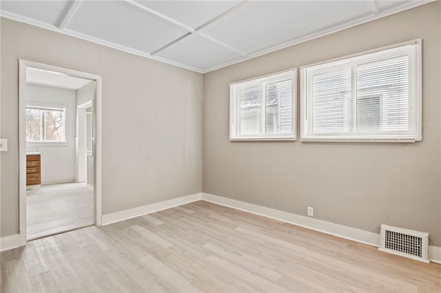 spare room with light hardwood / wood-style floors