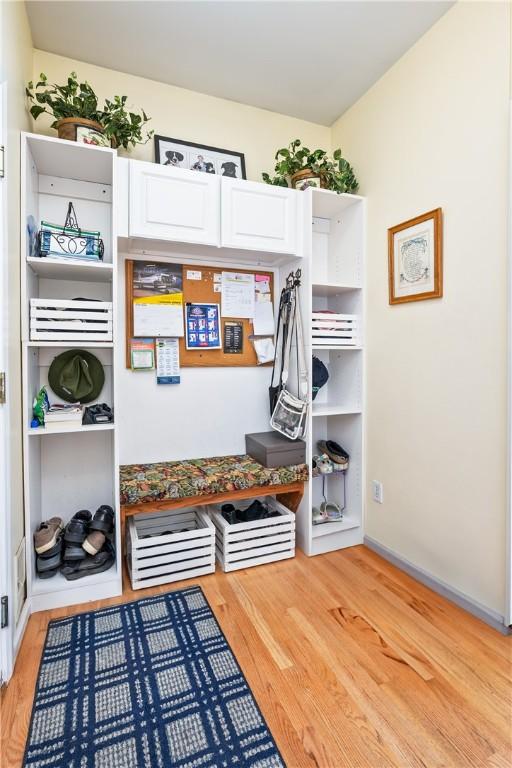 mudroom with light hardwood / wood-style flooring