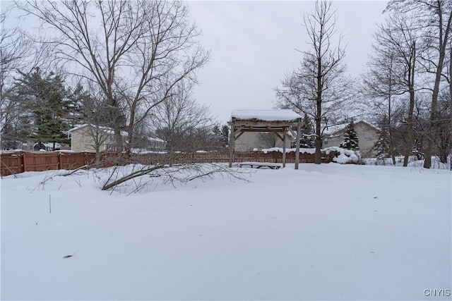 view of yard layered in snow