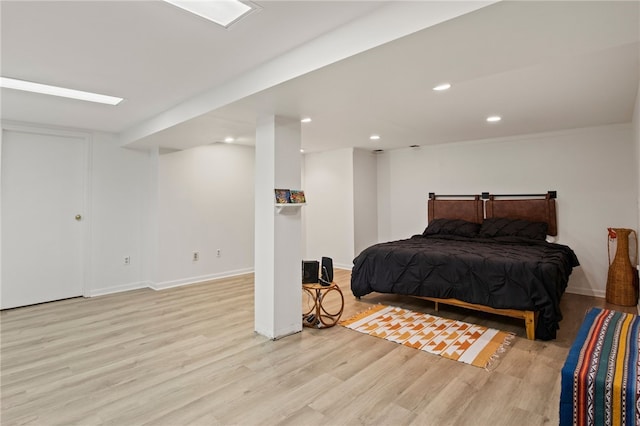 bedroom with light hardwood / wood-style flooring