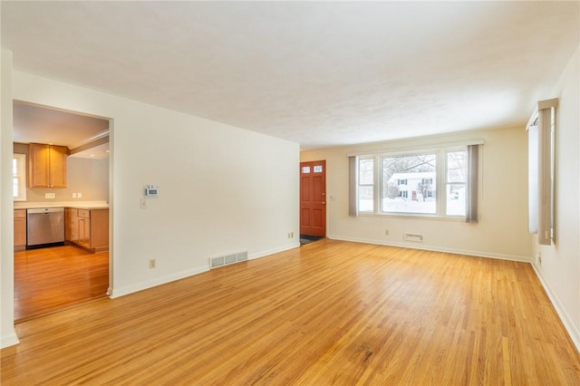 unfurnished living room with light wood-type flooring