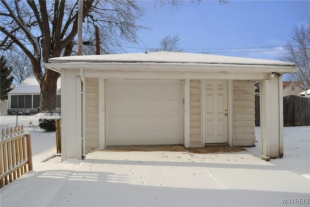 view of snow covered garage