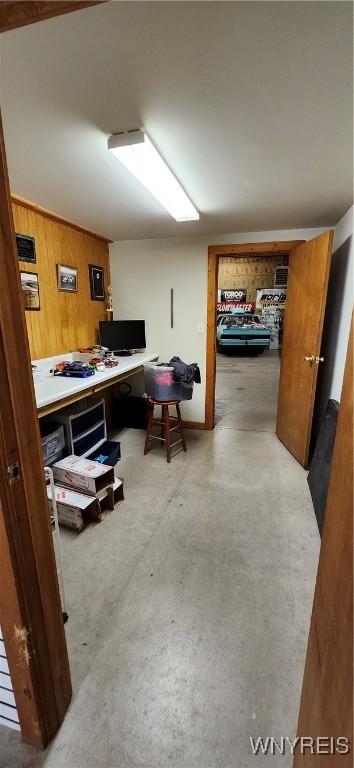 office area with wooden walls