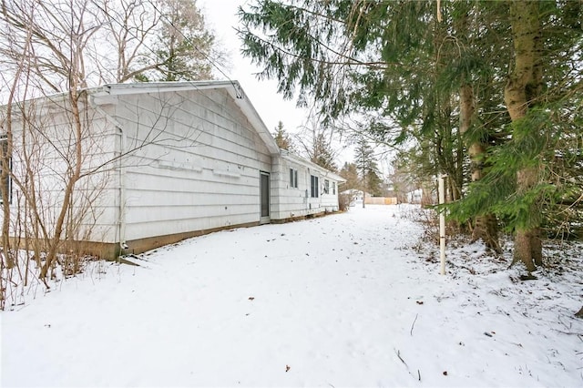 view of snow covered house