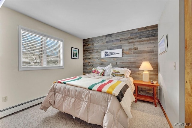 carpeted bedroom featuring baseboard heating and wood walls