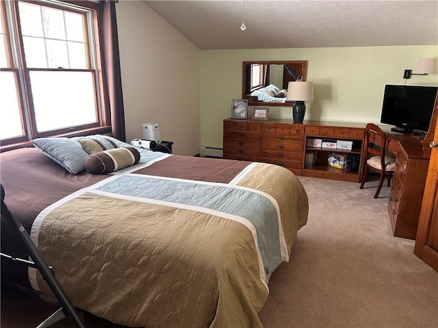 bedroom with carpet, vaulted ceiling, and a baseboard radiator