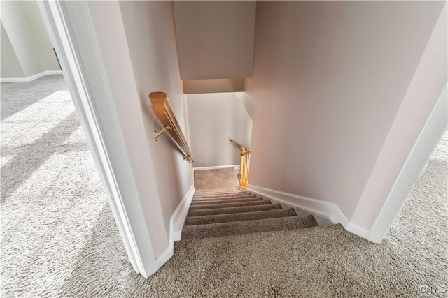 stairs with carpet flooring and baseboards