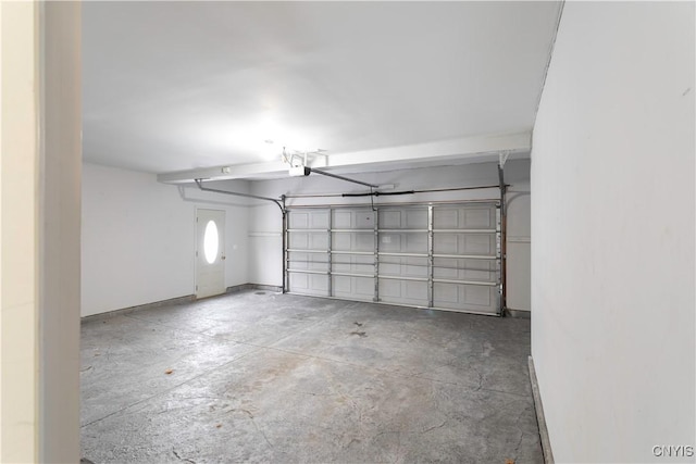 garage featuring baseboards and a garage door opener