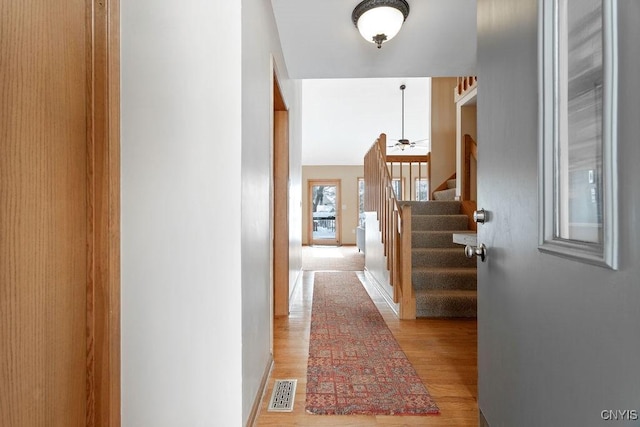 hallway featuring light wood-type flooring