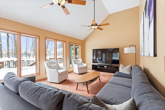 living room featuring ceiling fan, vaulted ceiling, and carpet floors