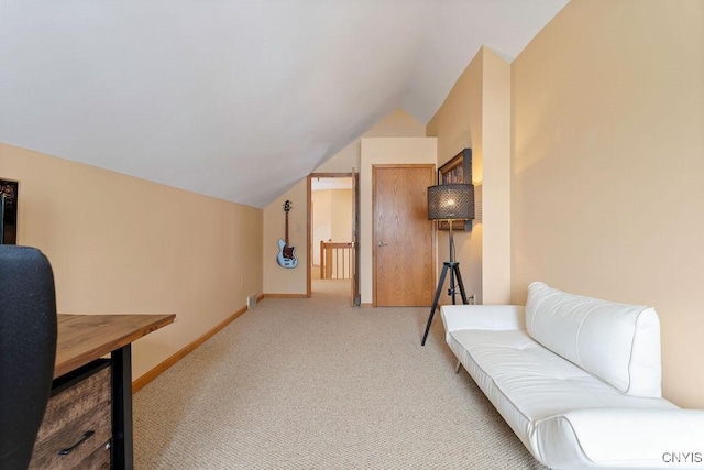 sitting room featuring lofted ceiling and light colored carpet