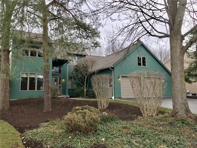 view of side of home featuring a garage