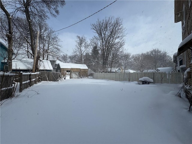 view of yard covered in snow