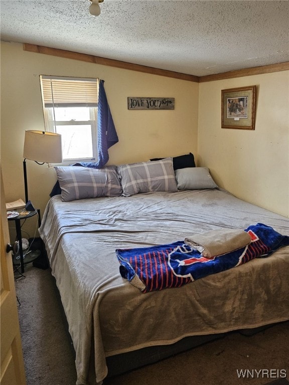 carpeted bedroom with a textured ceiling