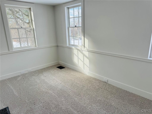 spare room featuring carpet floors