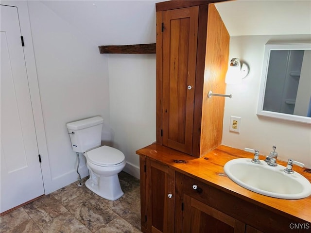 bathroom with toilet and vanity