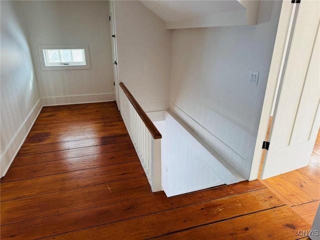 corridor with dark hardwood / wood-style floors