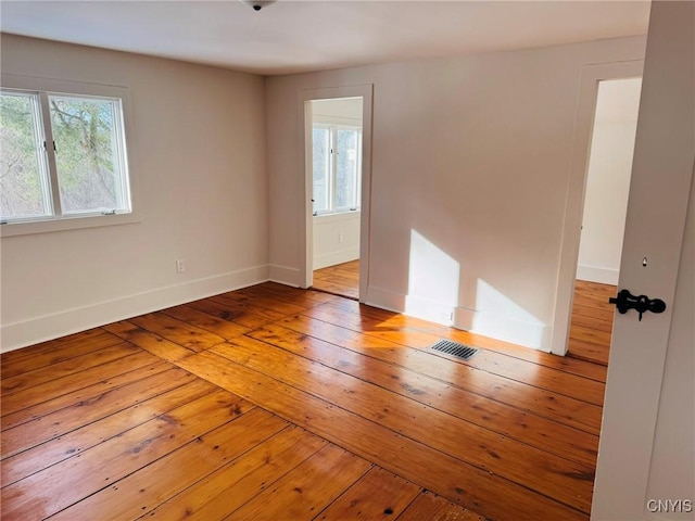 empty room with light hardwood / wood-style floors