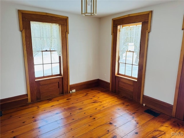 doorway with light hardwood / wood-style floors