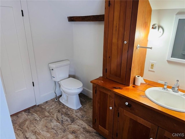 bathroom with toilet and vanity