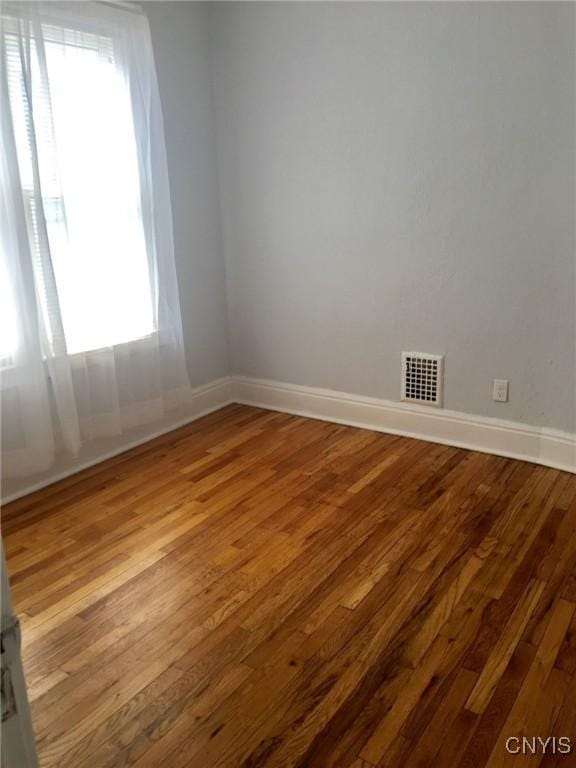 spare room with light hardwood / wood-style floors