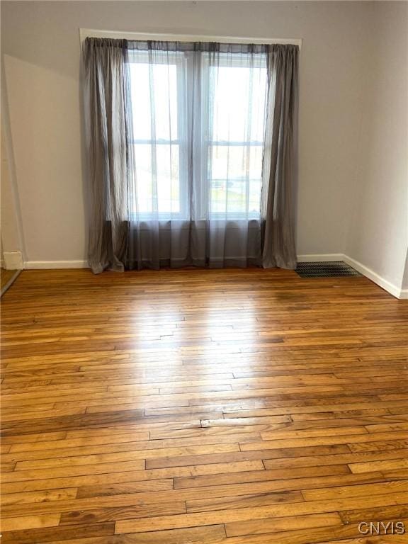 empty room featuring wood-type flooring