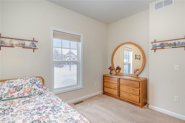 bedroom featuring light carpet