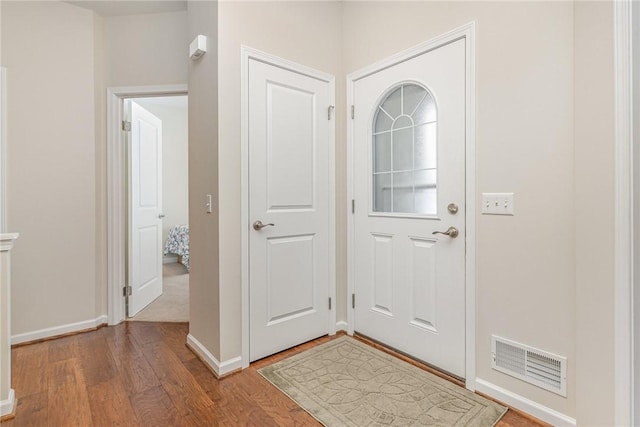 foyer entrance with wood-type flooring