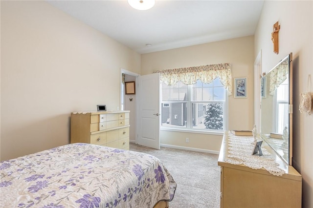 carpeted bedroom with multiple windows