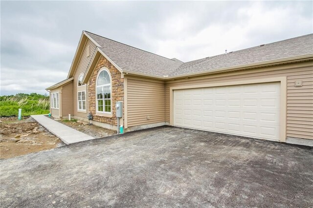 5134 Cheshire Glen Rd Unit 240A, Canandaigua-Town, NY 14424 - single story home featuring a garage