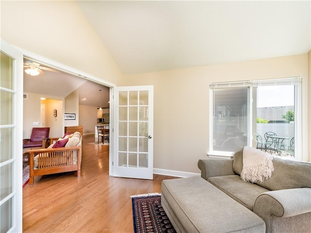 5134 Cheshire Glen Rd Unit 240A, Canandaigua-Town, NY 14424 - living room featuring light wood-type flooring, vaulted ceiling, and french doors