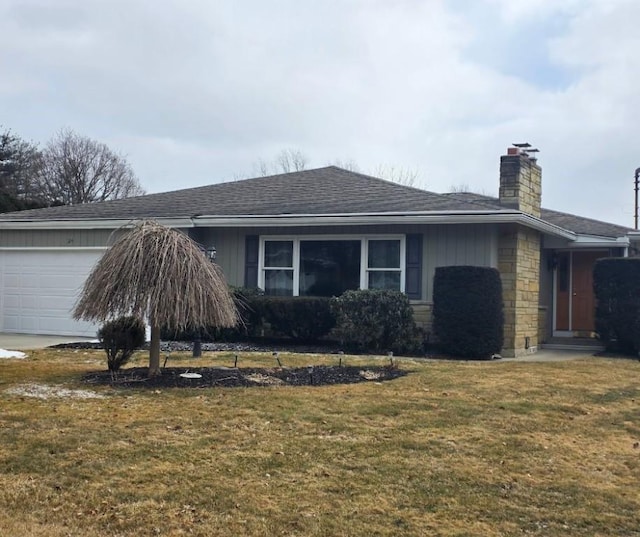 view of home's exterior featuring a lawn, stone siding, a shingled roof, a garage, and a chimney